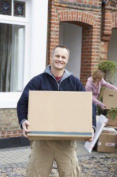 A moving team preparing boxes and furniture for a Bromley house removal