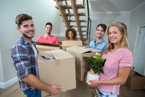 Furniture pick-up service removing a sofa in Bromley