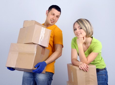 Careful loading of boxes and household items into a removal van