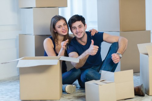 Local movers transporting furniture from a Bromley property