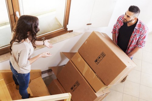 Professional furniture removal team in Bromley carrying heavy items