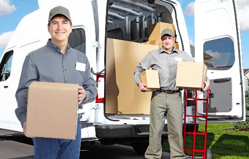Packed moving boxes and furniture prepared for house removals in Bromley