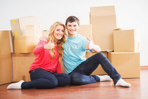 Moving crew handling furniture during a professional removal service