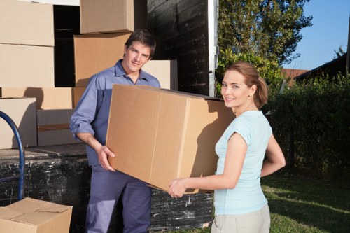 Local moving team handling boxes in Bromley